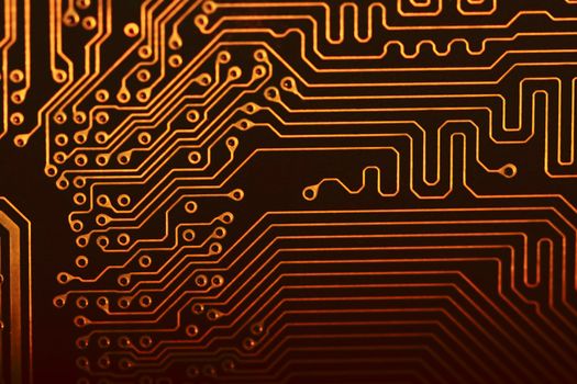 Close view of the circuits of a modern computer motherboard.