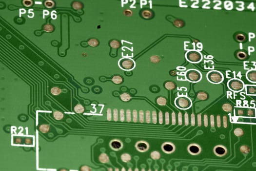 close view detail of a green computer circuit board.