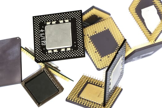 Close view detail of some computer microprocessors isolated on  a white background.