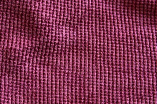 A close-up of a purple sweat-shirt.