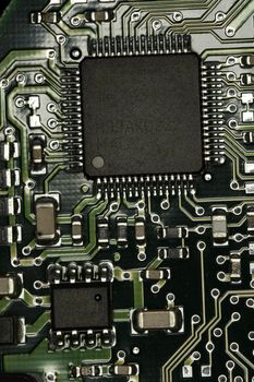 Close view detail of a circuit board with chips.