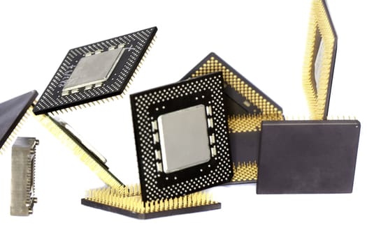 Close view detail of some computer microprocessors isolated on  a white background.