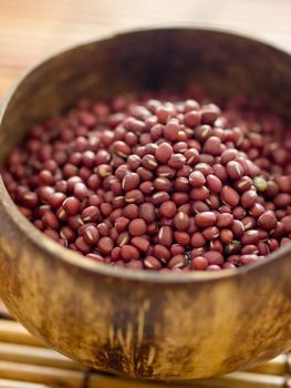 close up of a bowl of red mung beans