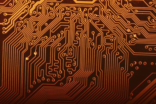 Close view of the circuits of a modern computer motherboard.