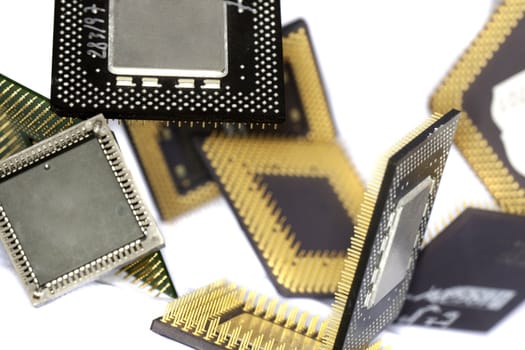 Close view detail of some computer microprocessors isolated on  a white background.