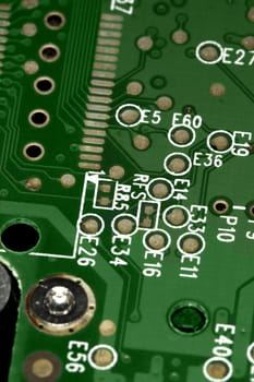 close view detail of a green computer circuit board.