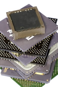 Close view detail of some computer microprocessors isolated on  a white background.