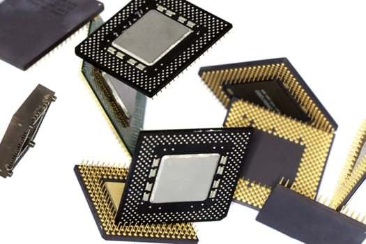Close view detail of some computer microprocessors isolated on  a white background.
