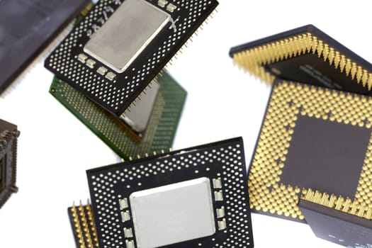 Close view detail of some computer microprocessors isolated on  a white background.