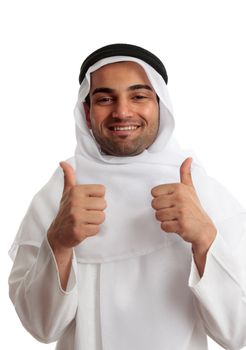 Ethnic man giving a thumbs up approval.  He is wearing cultural clothing, white thawb, ghutra and double black rope called an Igal.   Modern arab where the headress in a variety of ways as a fashion statement