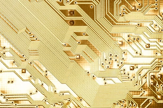 close view detail of   computer circuit chips on a golden light.