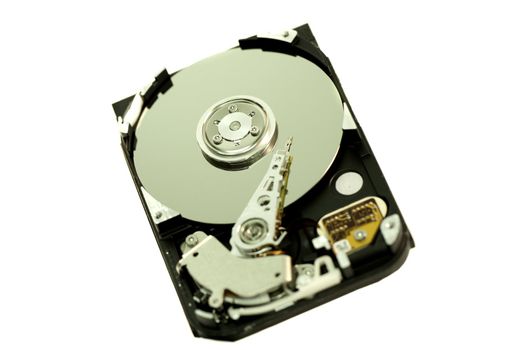 close view detail of the inside of a computer harddisk isolated on a white background.
