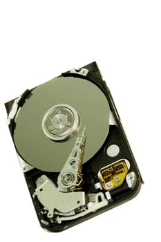 close view detail of the inside of a computer harddisk isolated on a white background.
