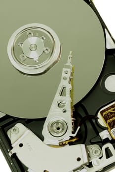 close view detail of the inside of a computer harddisk isolated on a white background.