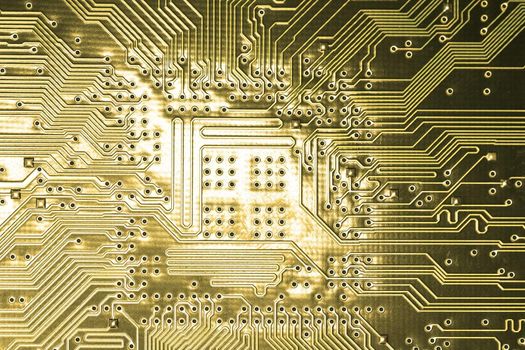 close view detail of   computer circuit chips on a golden light.