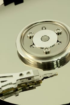 close view detail of the inside of a computer harddisk isolated on a white background.