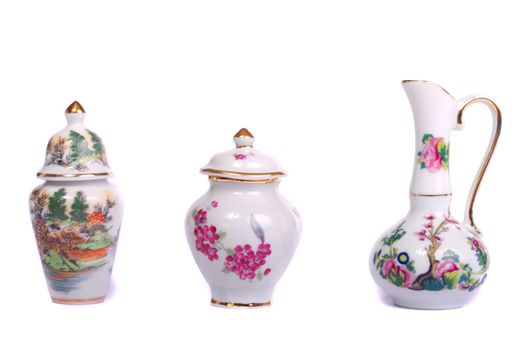 Close up view of some decorative ceramic vases isolated on a white background.