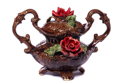 Close up view of a brown decorative vase isolated on a white background.