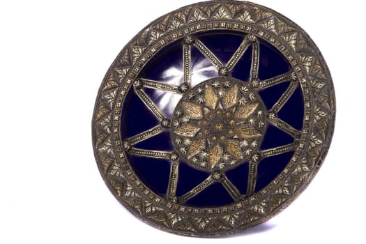 Close up view of a blue decorative morocco dish isolated on a white background.