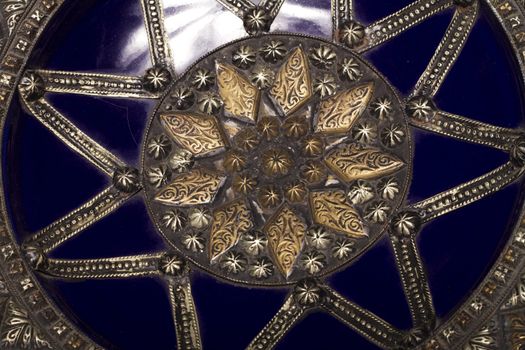 Close up view of a blue decorative morocco dish isolated on a white background.