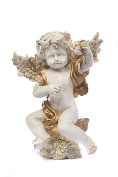 Close up view detail of a ceramic angel isolated on a white background.