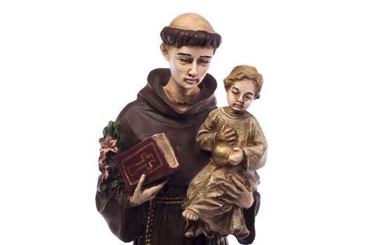 Close up view detail of a ceramic monk holding a child, isolated on a white background.