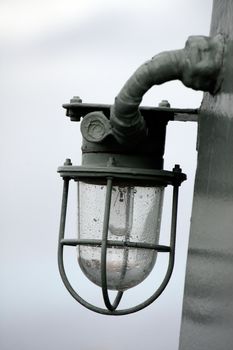 Close view of a lantern welded on a boat.