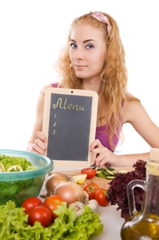 Pretty woman with menu board and vegetables over white