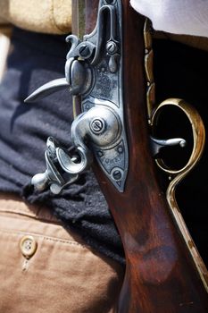 Old fashioned weapon closeup on the holster of a man.
