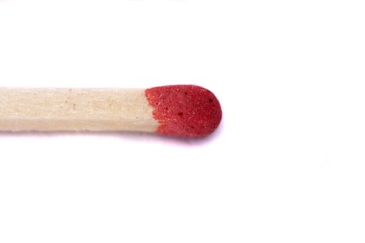 Close up view of single match  with red head on a white background.