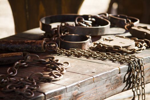 Close view detail of a table filled with torture instruments.
