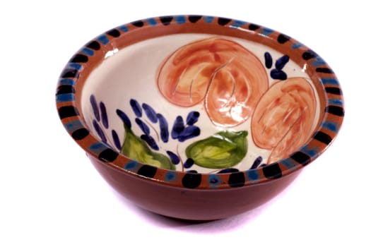 Close up view detail of a earthenware soup bowl isolated on a white background.