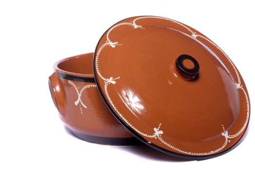 Close up view of traditional clay earthenware isolated on a white background.