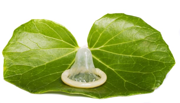 Close view of a condom isolated on a white background.