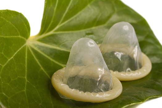 Close view of a condom isolated on a white background.