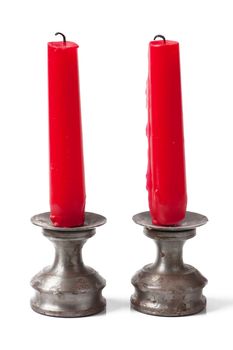 Two unlit candles isolated on the white