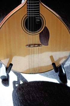 Closeup view of a classic guitar on a music studio.