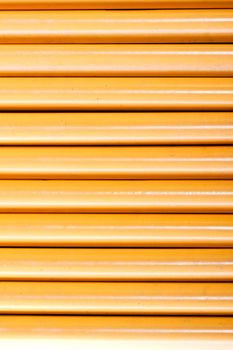 Close up view of a bunch of yellow pencils isolated on a white background.