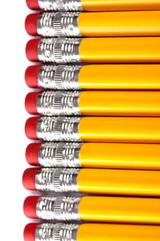 Close up view of a bunch of yellow pencils isolated on a white background.