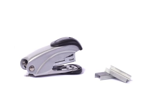 Close up view of a office stapler isolated on a white background.