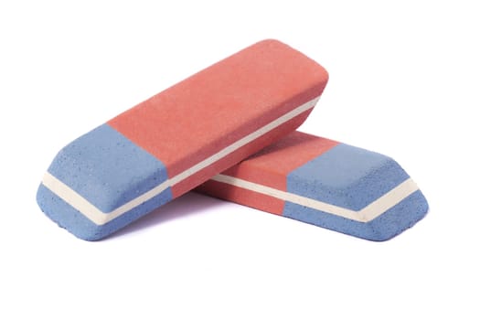 Close up view of a blue and red eraser isolated on a white background.