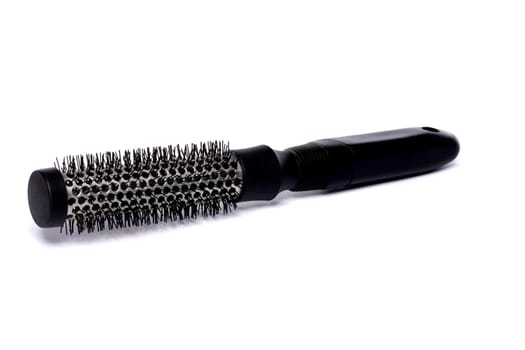 Close up view of a hair brush isolated on a white background.