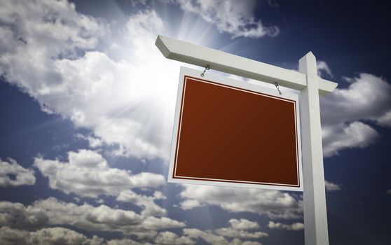 Blank Red Real Estate Sign Over Clouds and Sky Ready For Your Own Message.