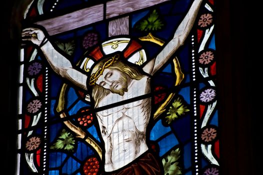 Beautiful stained glass window depicting Jesus on the crucifix