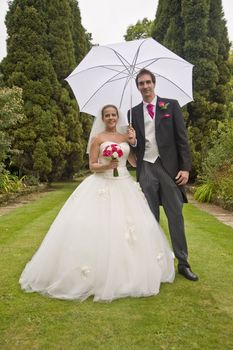 Attractive young bride and groom portrait outdoors