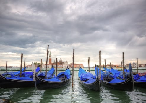 Gondloas at Saint Mrk's Square, San Marco Piazza Venice Italy under stormy sky