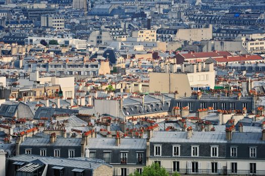 Aerial panorama above houses rooftops in a Paris
