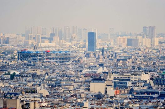 Aerial panorama above houses rooftops in a Paris