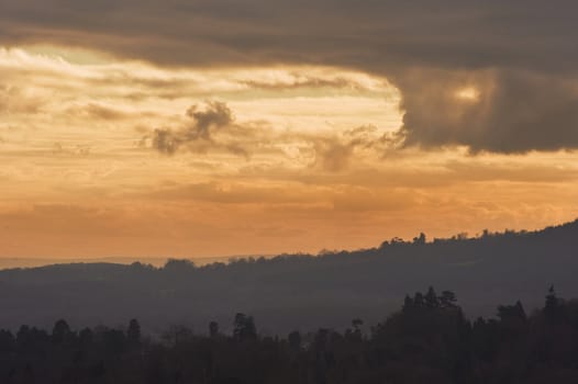 Beautiful colorful sunset over countryside landscape