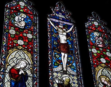 Detail of stained glass religious window in church Good Friday Easter